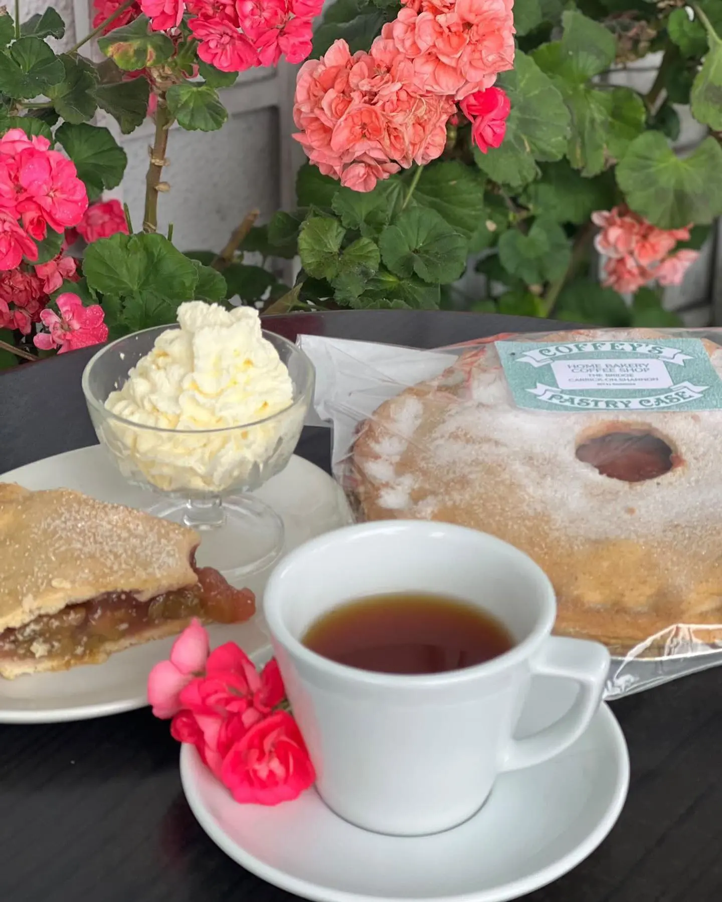 Fresh apple tart with cream and tea at Coffey's