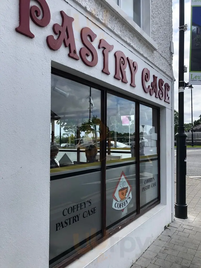 Corner view of Coffey's Pastry Case showing shop signage